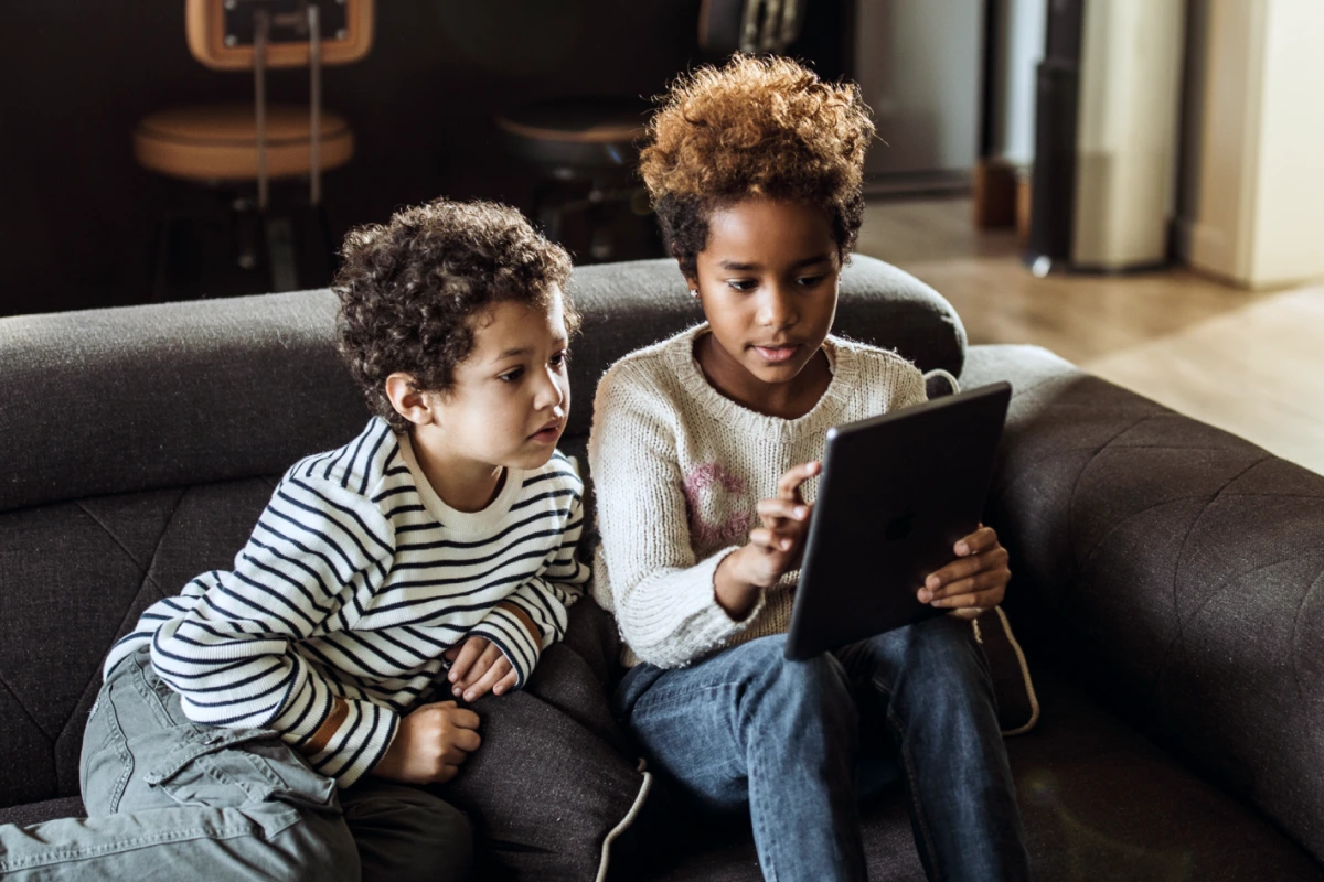 Children using fiber internet on their tablet