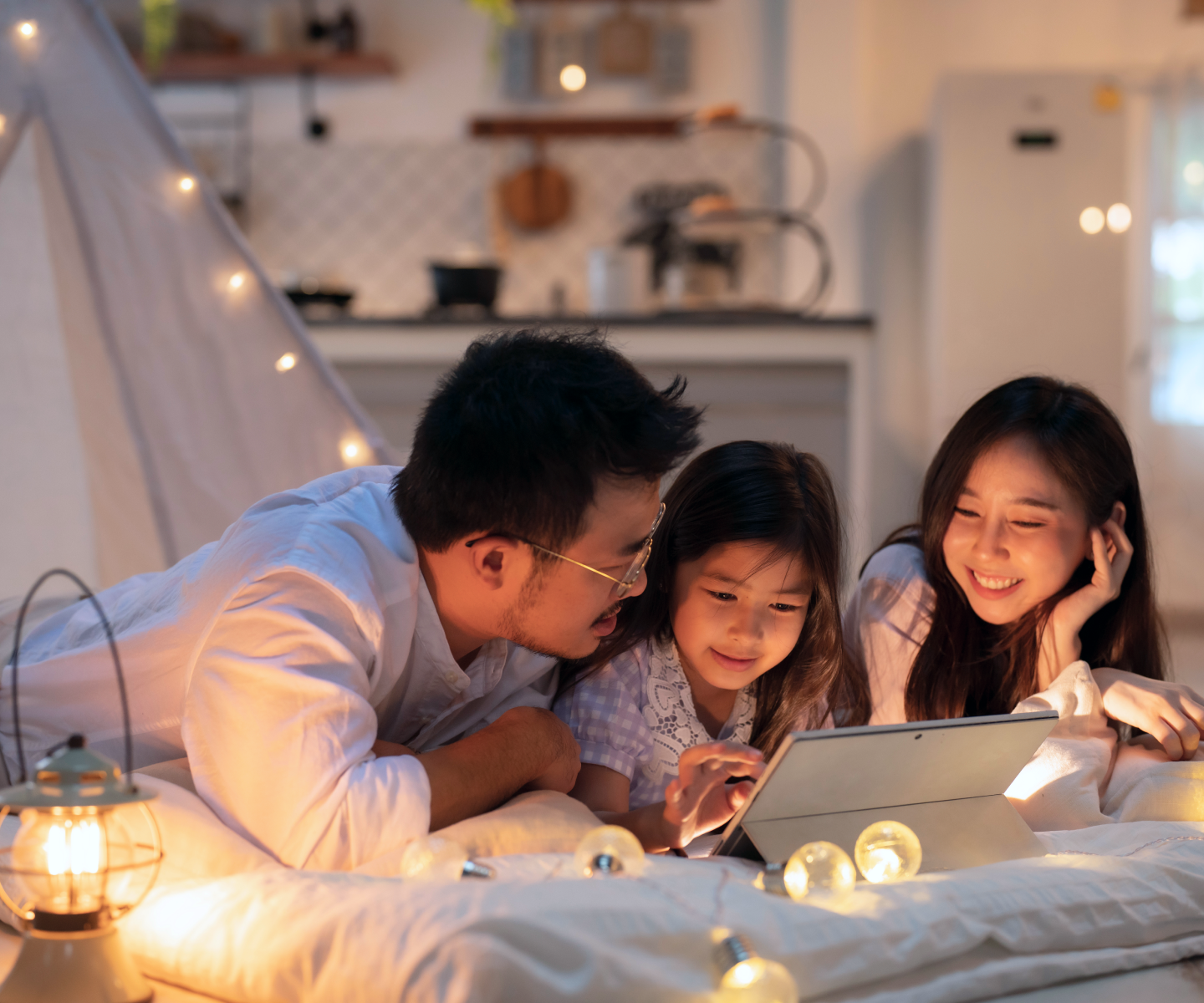 Family Laying Together Using Frontier Fiber 2 gig Internet